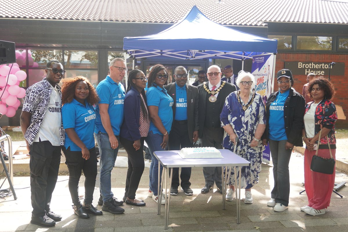 Mayor Robin Garrido, Mayoress Karen Garrido and Connect Talent Trustees cutting the centenary cake together